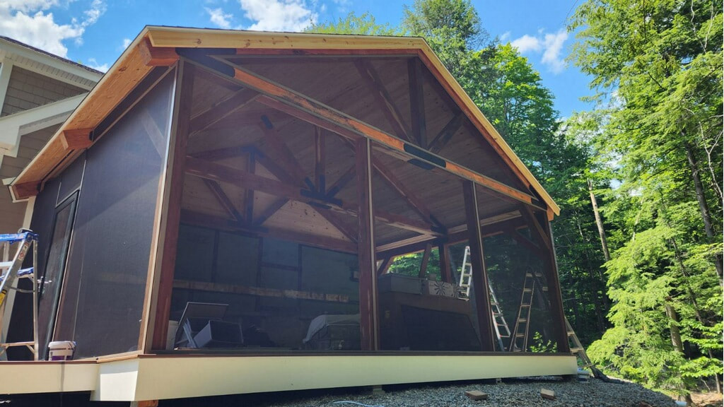 Screened heavy timber porch addition with cathedral ceiling
