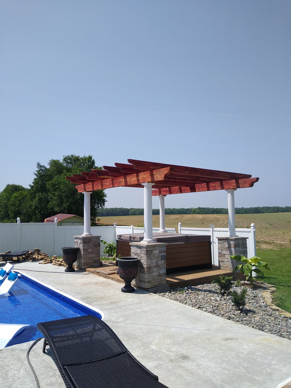 Poolside pergola with stone columns and stained timber rafters