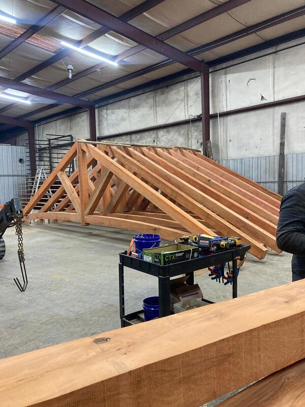 Heavy timber truss with mortise-and-tenon joinery and steel connector plates